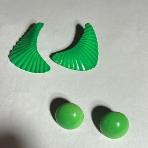 Two pairs of green costume jewelry pierced earrings.